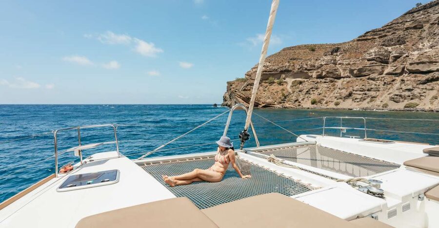 Santorini: Luxury Catamaran Day Trip with Meal and Open Bar - The catamaran, crew, and space aboard