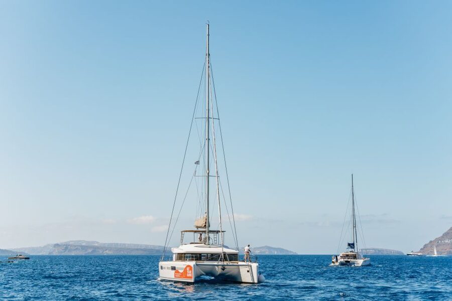 Santorini: Luxury Catamaran Day Trip with Meal and Open Bar - Hotel pickup and the trip to the port