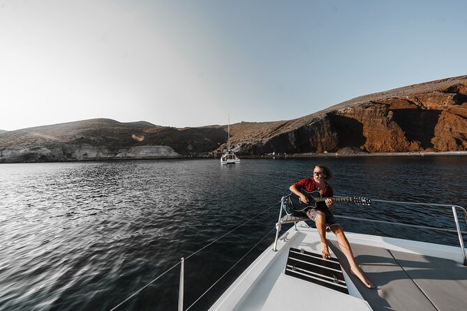 Santorini Luxury Catamaran Private Cruise - Red Beach, White Beach, and the volcanic cliffs