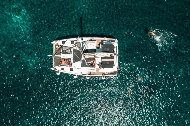 Santorini: Majestic Catamaran Cruise with Meal and Drinks - Volcanic beaches, Red Beach, and White Beach