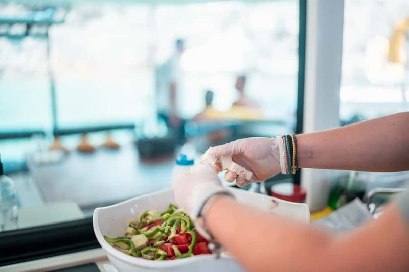 Santorini: Majestic Catamaran Cruise with Meal and Drinks - Greek food served on the boat