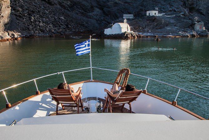 Santorini: Motor Yacht Sunset Cruise with 5-Course Dinner - Leaving Vlihada for Santorini’s southern coast