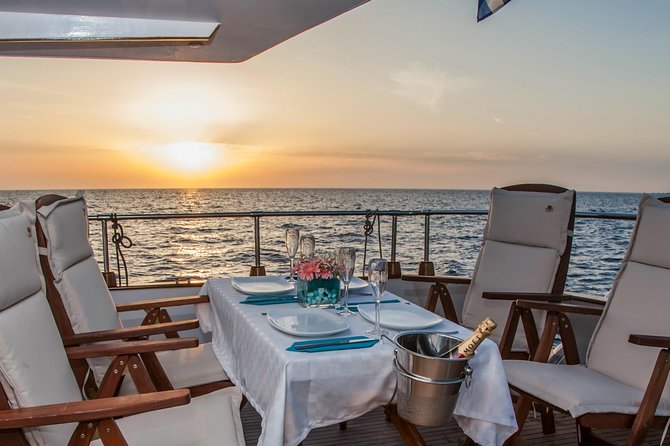 Santorini: Motor Yacht Sunset Cruise with 5-Course Dinner - Watching the sunset from the water