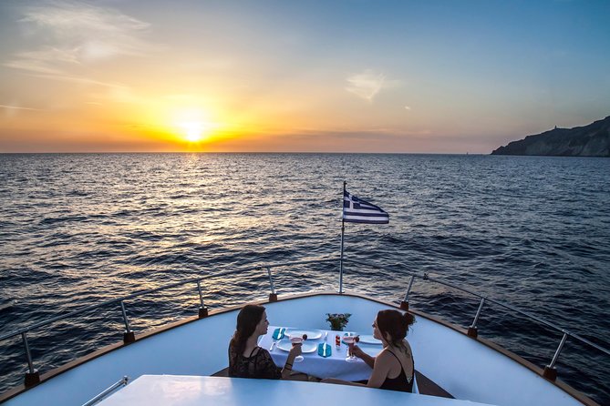 Santorini: Motor Yacht Sunset Cruise with 5-Course Dinner - Crossing the caldera between two volcanic islands