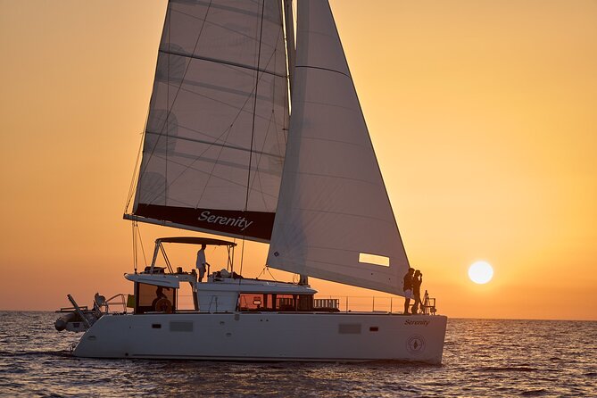 Santorini Oia: Private Sunset Catamaran Cruise with BBQ & Drinks - Greek food, local wine, and the crew’s role