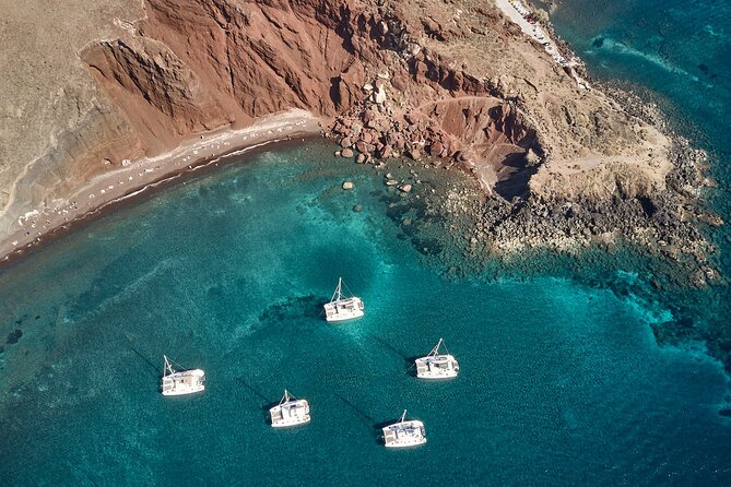 Santorini Oia: Private Sunset Catamaran Cruise with BBQ & Drinks - Thirassia, a quiet first stop near Oia