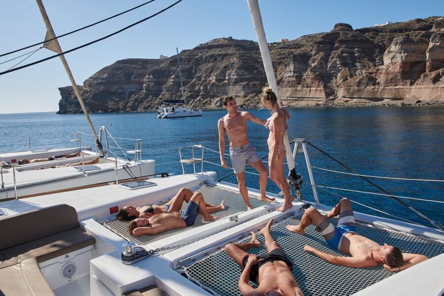 Santorini: Platinum Catamaran Cruise w/ BBQ Meal & Open Bar - Swimming near Palea Kameni hot springs