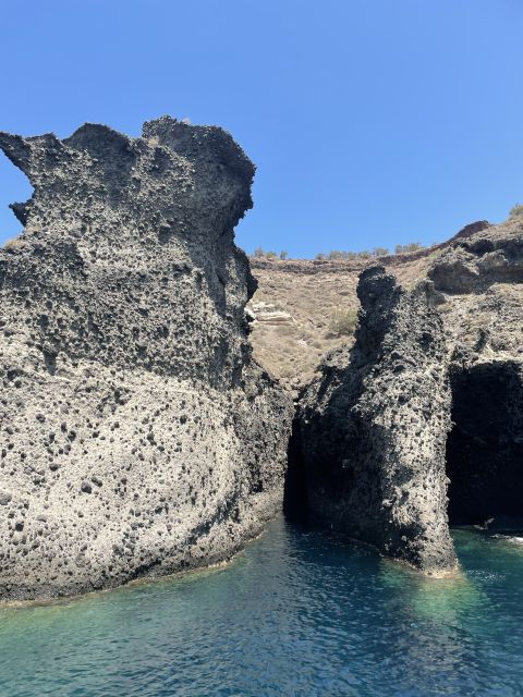 Santorini: Private All-In Catamaran Cruise, with Food|Drinks - Caldera views and volcanic rock