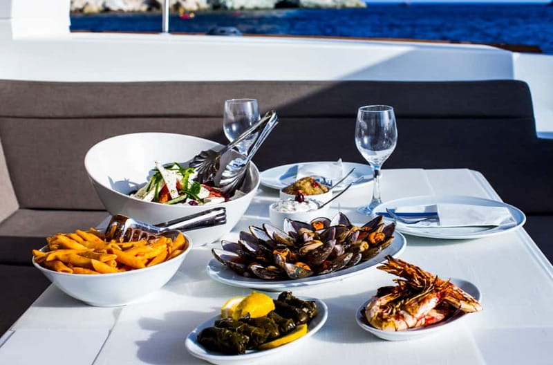 Santorini: Private Catamaran Cruise with BBQ Meal and Drinks - A Greek lunch prepared on deck