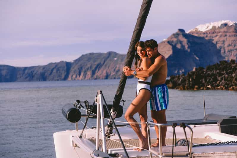 Santorini: Private Catamaran Tour with BBQ Meal and Drinks - Leaving Vlychada for Santorini’s red cliffs