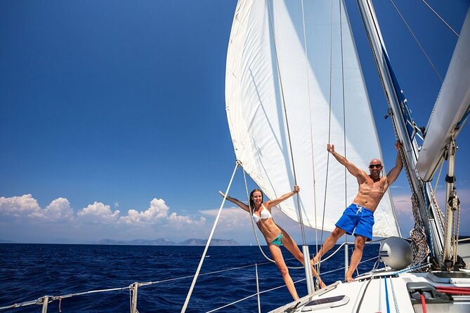 Santorini: Private Sailing Yacht Cruise with Meal and Drinks - The lighthouse, caldera, and volcanic islands