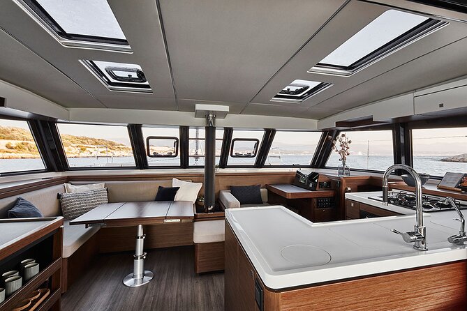 Santorini Private Tour Half-Day Sailing Platinum Catamaran Cruise - Mesa Pigadia: a practical swimming and snorkeling stop