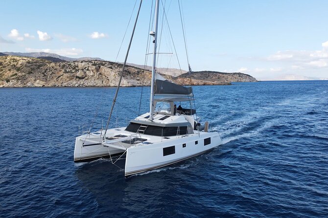 Santorini Private Tour Half-Day Sailing Platinum Catamaran Cruise - Red Beach: iron-red cliffs beside the water