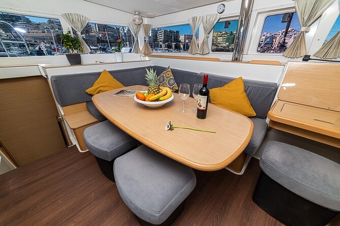 Small Group Santorini Catamaran Cruise with BBQ - Black Mountain, The Lighthouse, And The Caldera
