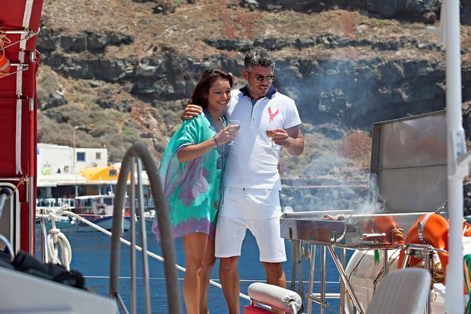 Sunset Sailing Catamaran Cruise in Santorini with BBQ and Drinks - Hot Springs: warm water with a sulfur warning